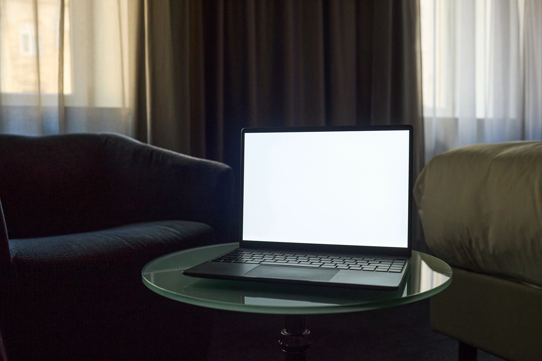 Laptop displaying blank screen for digital download mockup